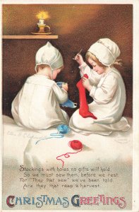 Ellen Clapsaddle Christmas Greetings Two Girls Repairing Stockings, Postcard