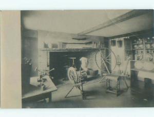 rppc c1910 ANTIQUE SPINNING WHEELS BY THE FIREPLACE AC8753