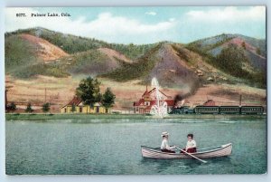 c1940's Palmer Lake Colorado Couple Boating Locomotive Mountain Houses Postcard