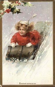 Christmas Child Girl Sledding Holly Embossed c1900s-10s Postcard