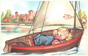 Cute Little Baby Smiling While Lying At Boat In The Seashore Vintage Postcard