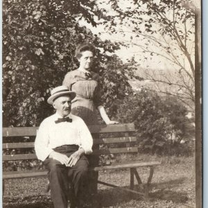 c1910s Old Married Couple Outdoors RPPC Gentleman Man Sits Bench Real Photo A212