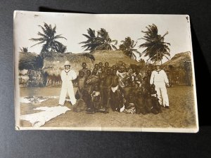 Mint RPPC Postcard German Sailors with Natives Hut Pacific Islands