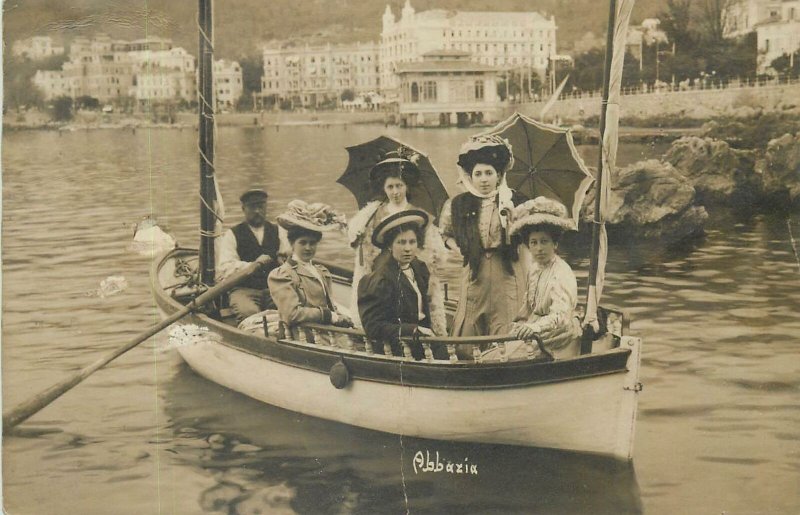 Social History Postcard Abbazia rowing boat elegant ladies fancy hats umbrellas