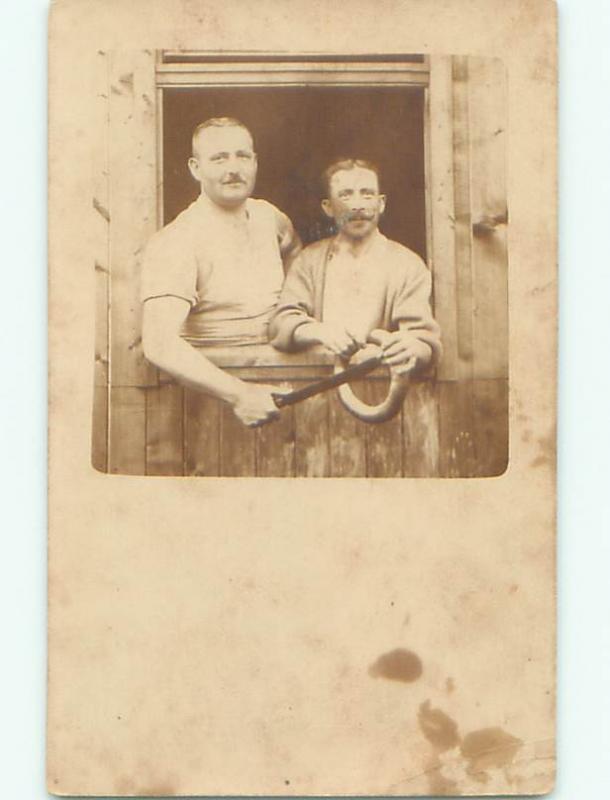 rppc 1920's MAN PUTS LARGE KNIFE INTO RING BEING HELD AC8520