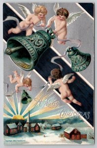 Christmas Cherubs with Bells Skies Above Snow Covered Church Town Postcard Z25