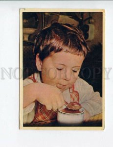 3153977 RUSSIA Soviet Child w/ Jam Old color 1958 PC