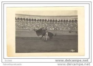 RP Bullfighter dodges bull with cape, Spain, 1910s