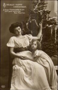 Christmas - Mother & Daughter in Front of Tree c1910 Real Photo Postcard