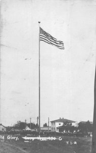 Military camp with view of Old Glory on flagpole real photo pc ZB548031 