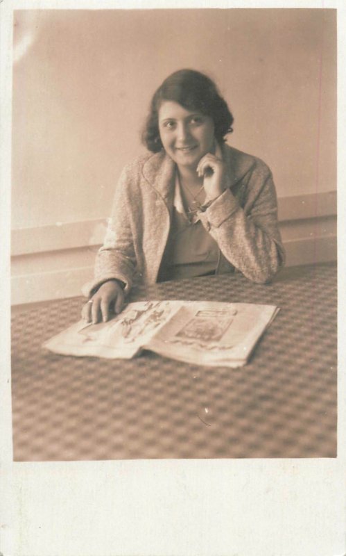 Postcard smiling lady reading newspaper photo