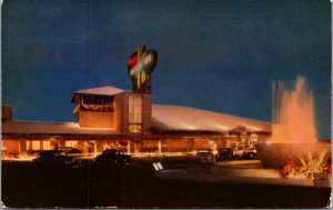 Postcard Night View of Wilbur Clark's Desert Inn in Las Vegas, Nevada