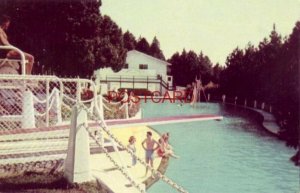 lifeguard watches over SWIMMING POOL AT GRAND HOTEL, MACKINAC ISLAND, MICHIGAN