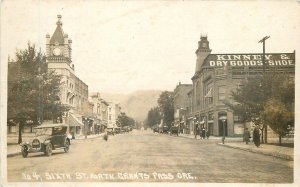 Postcard RPPC Oregon Grants Pass Sixth Street automobiles Wesley Andrews 23-1852