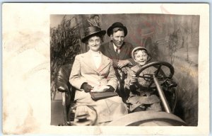 c1910s Happy Family in Studio Car RPPC Smile Young Boy Kid Drive Real Photo A162