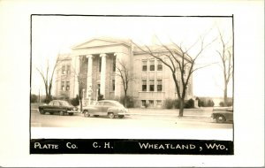 RPPC Platte County Court House Wheatland WY Street View Cars UNP Postcard