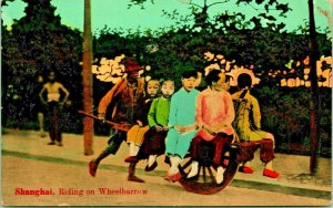 Shanghai China Riding on Wheelbarrow 1910s UNP Universal Postcard Co