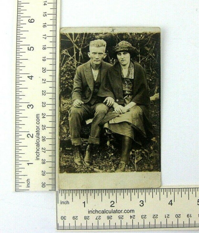 1910s 20s RPPC Rural Farm Man And Woman Seated On Log Postcard Americana