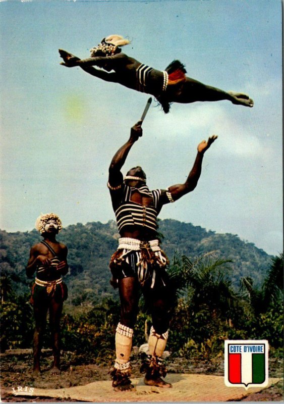 VINTAGE CONTINENTAL SIZE POSTCARD GROUP OF KNIFE DANCERS IN IVORY COAST AFRICA