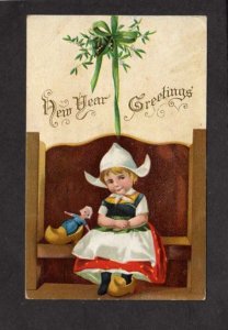 New Years Greetings Postcard Dutch Girl Bench Doll in Wood Wooden Shoe 1910