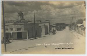 BRACKETTVILLE, TEXAS FIRST STATE BANK AND STREET SCENE RPPC POSTCARD