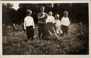 RPPC Young Boys With Baby Sibling Photo in Garden c1910 Postcard U6