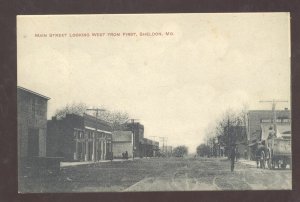 SHELDON MISSOURI DOWNTOWN MAIN STREET SCENE DIRT ROAD VINTAGE POSTCARD