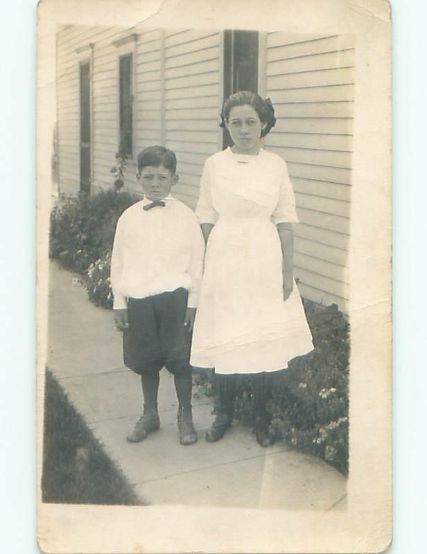 Bent Pre-1918 rppc PRETTY GIRL WITH BOW IN HAIR & LITTLE BROTHER o1983