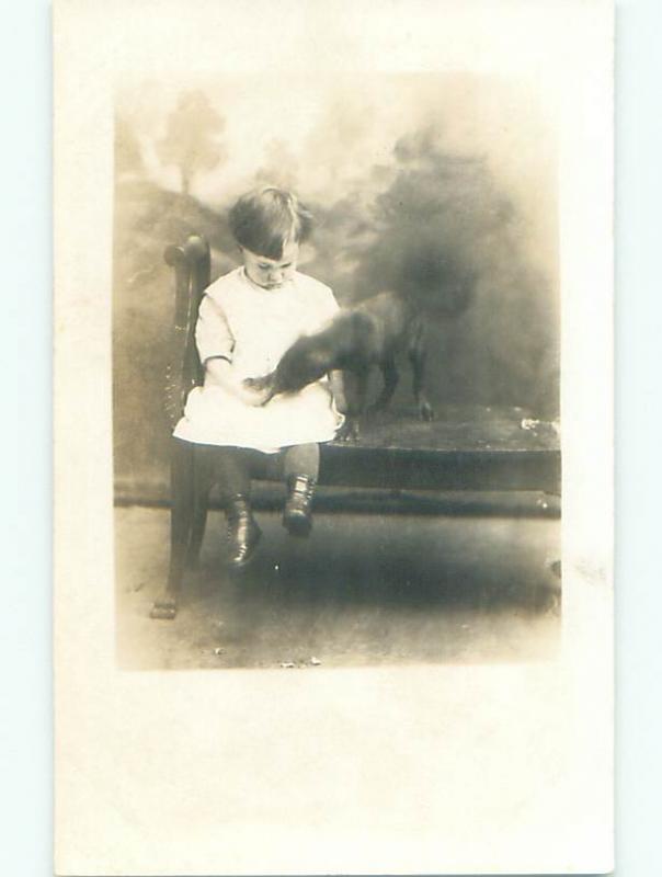 Pre-1920's rppc BLURRY DOG EATING FROM CHILD'S HAND o2286