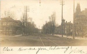 Postcard RPPC Michigan Menominee Street View Trolley Train Tracks 23-10048