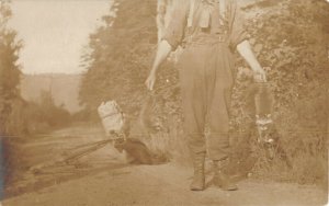 boy with his two young Racoons c1909 rppc postcard