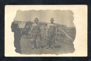 RPPC DODGE CITY KANSAS FARMING FARMERS CARRYING BUCKETS REAL PHOTO POSTCARD