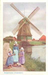 Postcard Netherlands native types folk costumes rural area watermill Volendam