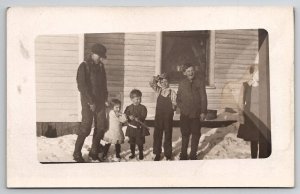 RPPC Group of Little Children Boy with Toy Gun in Snow Postcard E29