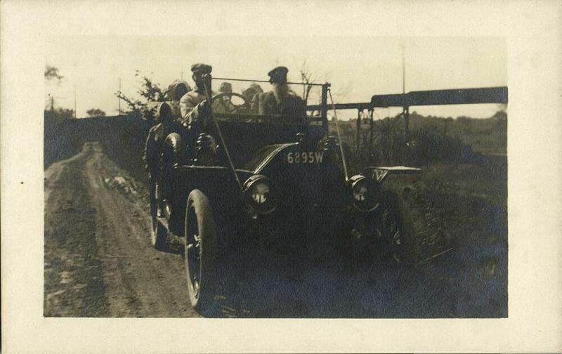 Group of People Driving in Old Car of Unknown Brand (1910s) RPPC Postcard