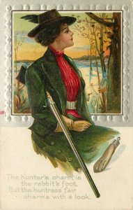 c1910 Embossed Postcard Woman Hunter & Rifle, Rabbit's Foot Charm, Unposted