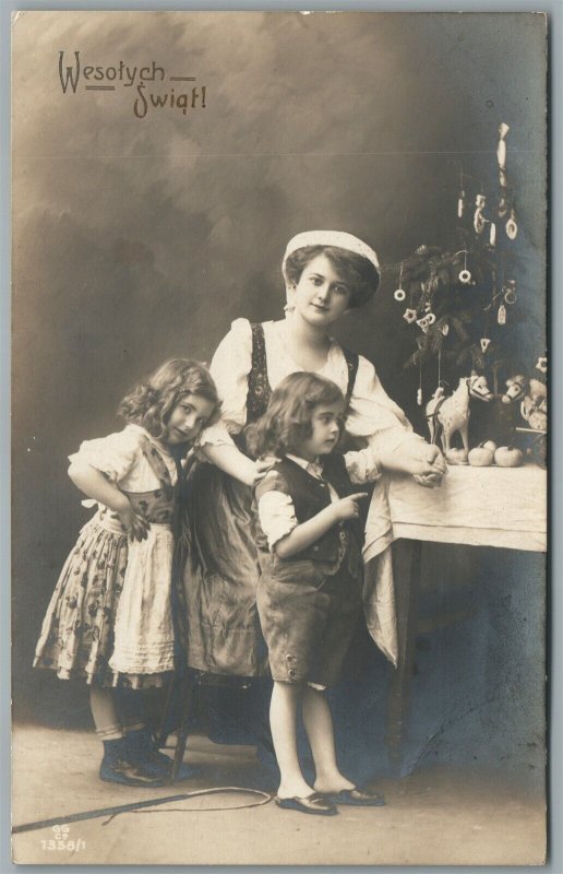 FAMILY w/ CHRISTMAS TREE ANTIQUE REAL PHOTO POSTCARD RPPC w/GREETING in POLISH