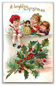 A Bright Christmas Children Playing With Doll Holly Embossed DB Postcard R10