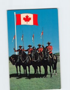 Postcard Royal Canadian Mounted Police and the new flag of Canada