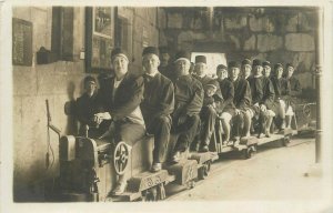 An iconic real photo postcard social history people train railroad mine entrance