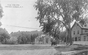 Center Harbor NH The Square Dirt Street Post Office Library RPPC Postcard