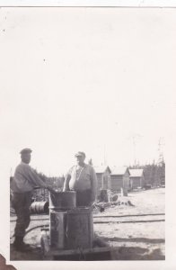 RP: Logging Camp 12 , Minnesota, 1910s ; 2 men 