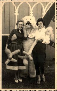 Bizarre Unusual Pretty Women w/ Balloon Animals Pose Person in Polar Bear Suit