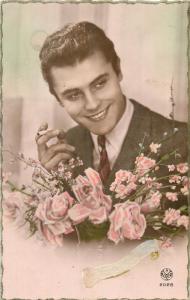 Handsome young man with cigarette & flowers