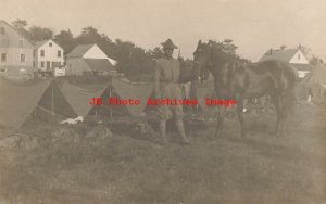 Black Americana, RPPC, Cavalry Soldier with his horse Standing in Front of Tents
