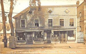 Springfield VT Old Corner Store Front's Building Clock RPPC Postcard