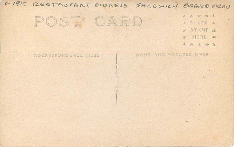 C-1910 2 men suits Restaurant Owners Sandwich Board menu RPPC postcard 6617