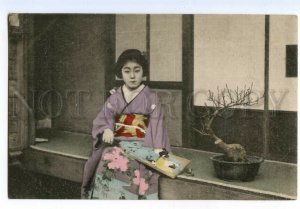 497171 Japan geisha girl in kimono with fan and bonsai tree tinted postcard