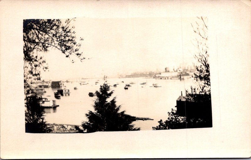 RPPC view of a harbor beach houseboats boats fishing boats industrial