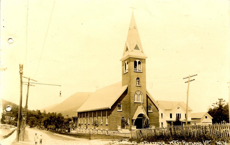 VT - West Rutland. St Stanislaus Church, Mt Hanley in distance *RPPC  (holes)...